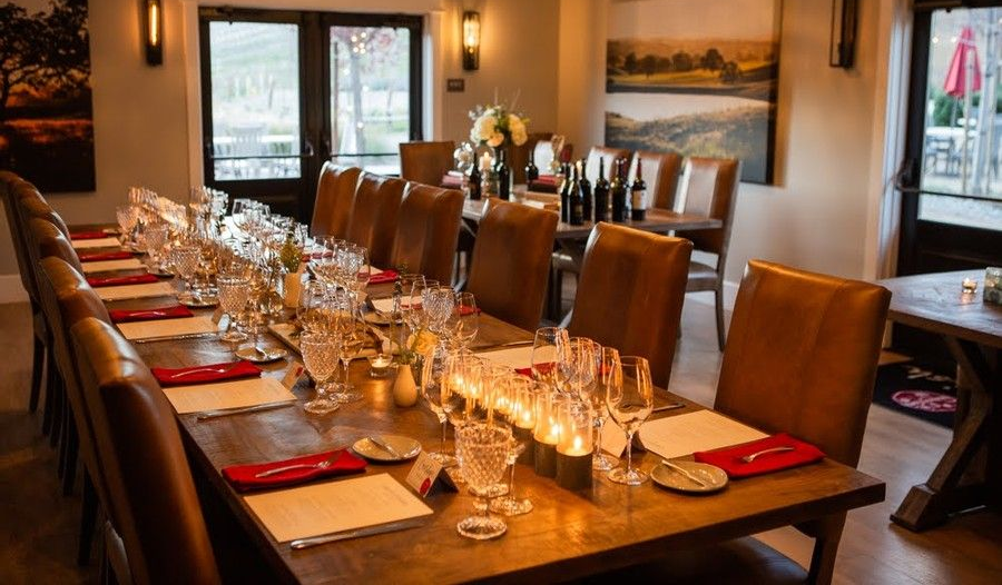 Banquet Room in the Parrish Family Vineyard tasting room complete with table settings and glassware. 