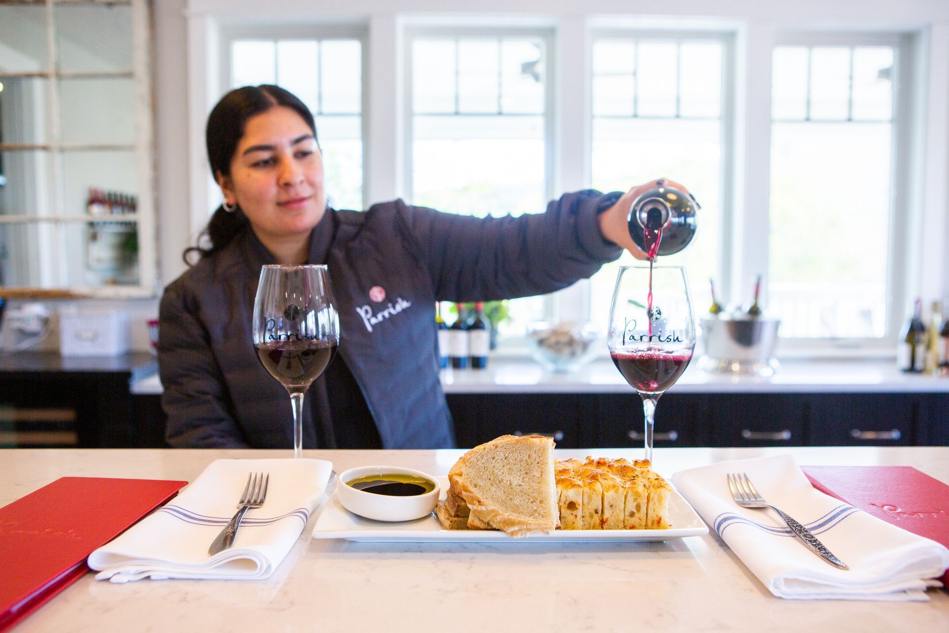 Experience estate Cabernet Sauvignon, house-made food offerings, and wrap-around vineyard views in Paso Robles at Parrish Family Vineyard.