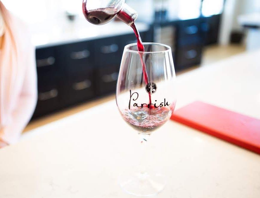 Red wine being poured into a glass.