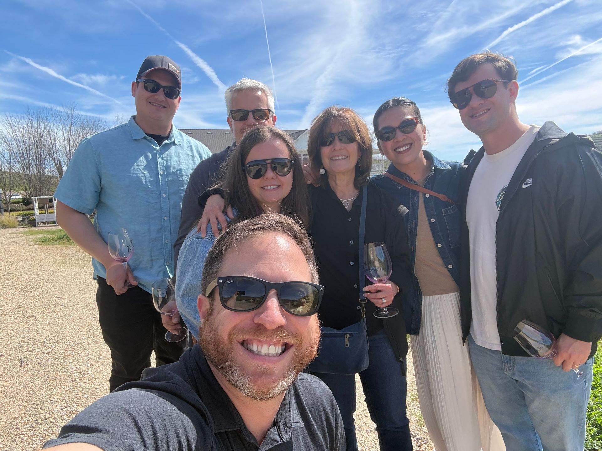 Group of six guests at Parrish Family Vineyard on a wine tour with a Parrish employee.