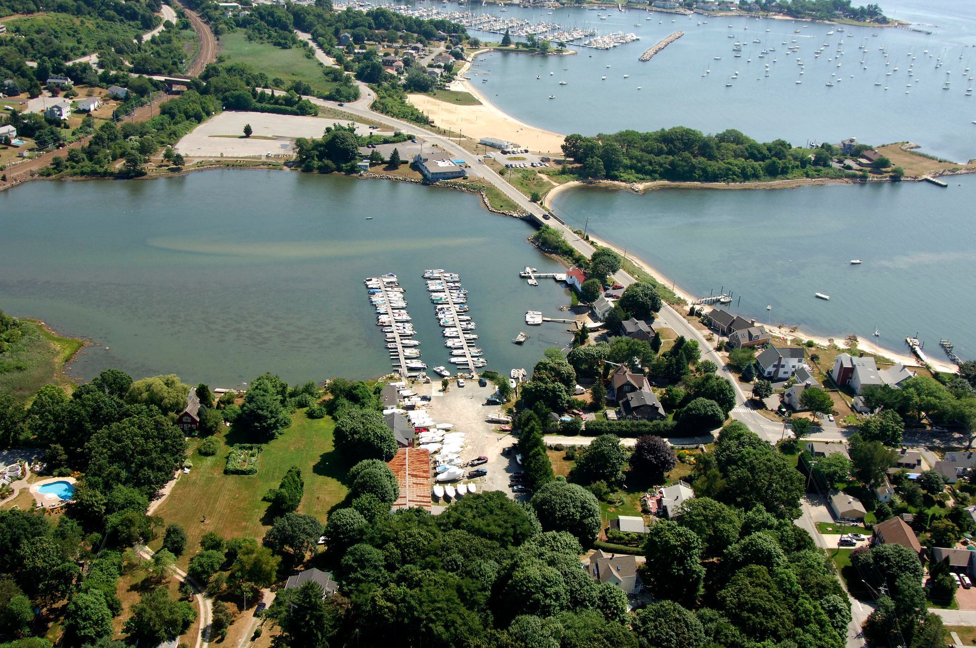 An aerial view of palmers cove marina in Connecticut, showing an abundant amount of dock slips.