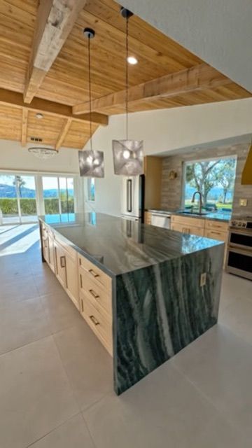 Covered outdoor kitchen and backyard entertaining space in Rancho Bernardo