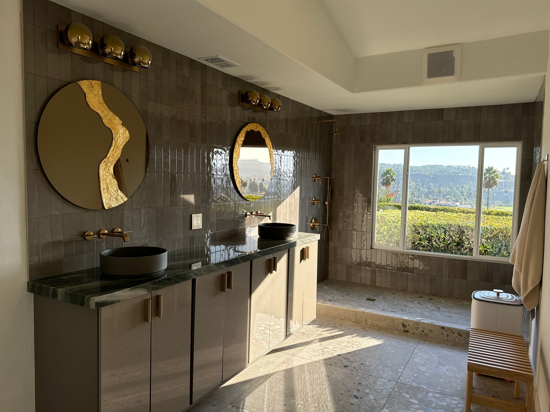 Dark modern kitchen renovation with quartz counters in Del Mar