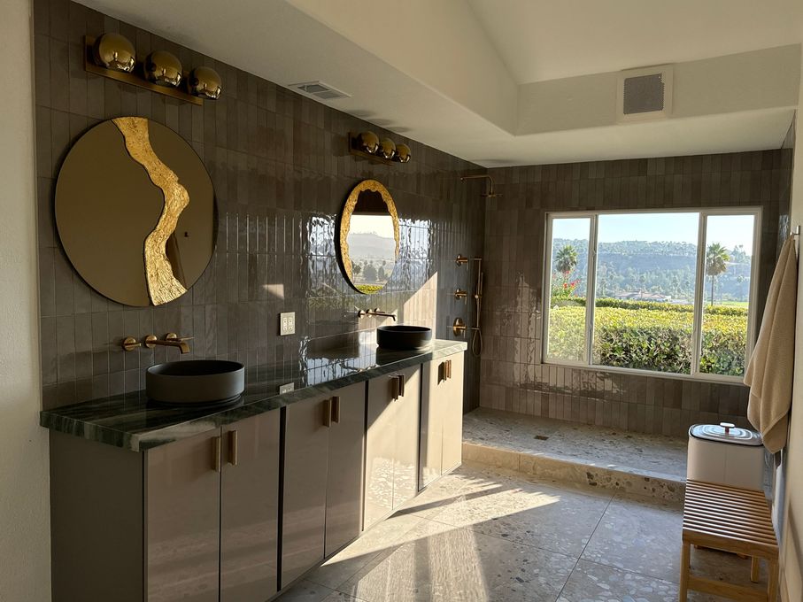 Dark modern kitchen renovation with quartz counters in Del Mar