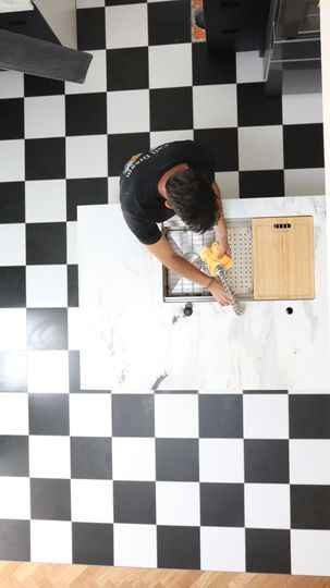 Black-and-white tile installation during a bathroom remodel in Coronado