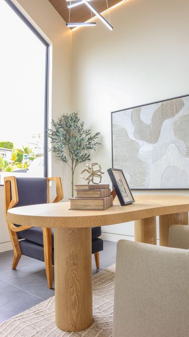 Modern dining area with wood table and natural light in Solana Beach