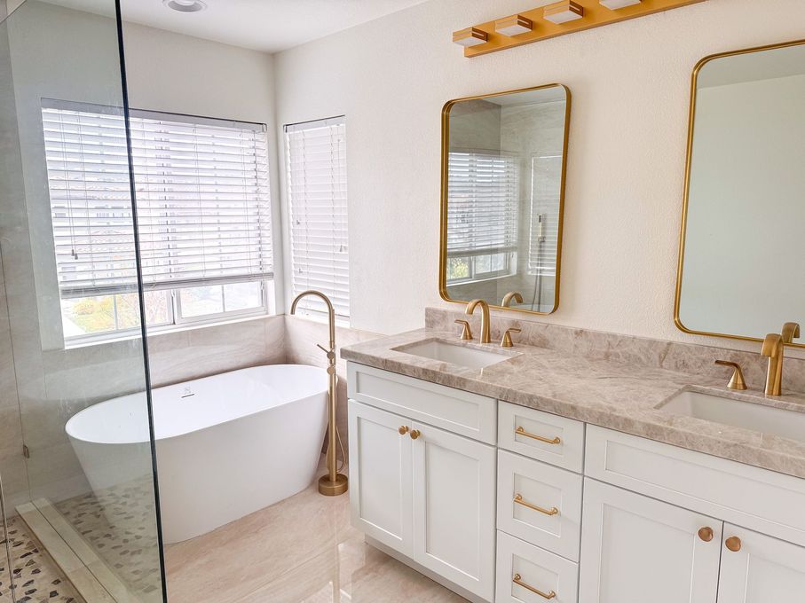 Spa-style bathroom renovation with freestanding tub and double vanity in La Jolla