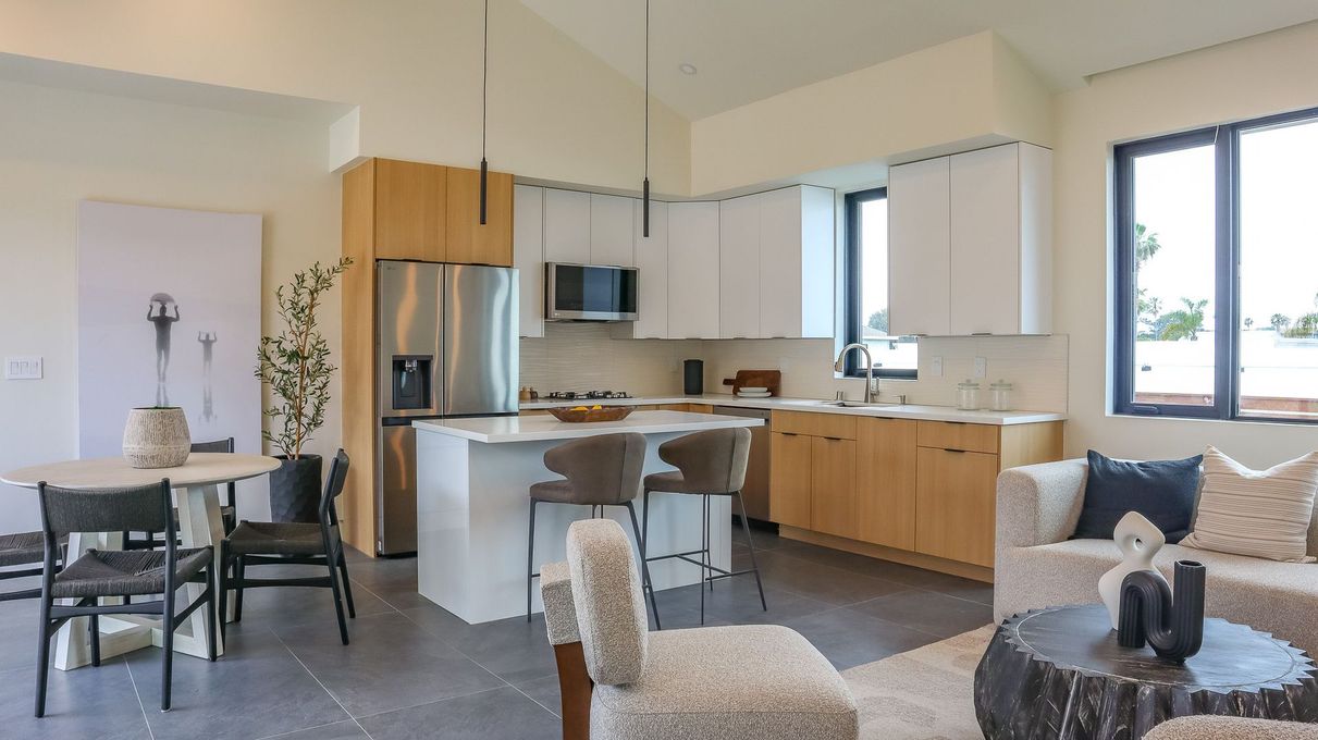 Modern kitchen remodel with natural wood cabinets in San Diego