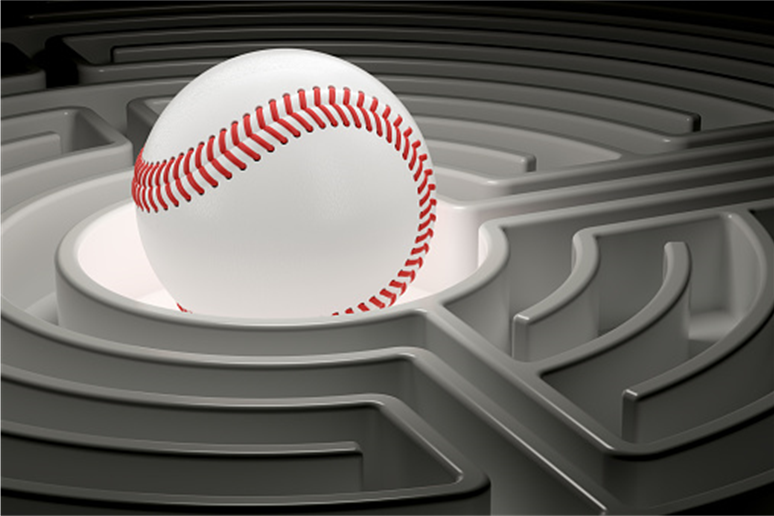 Baseball resting in a gray labyrinth-like maze
