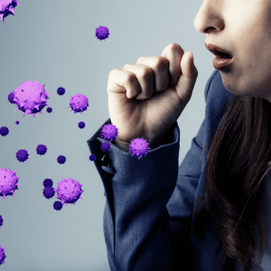 Person coughing near floating purple germs on a blue background
