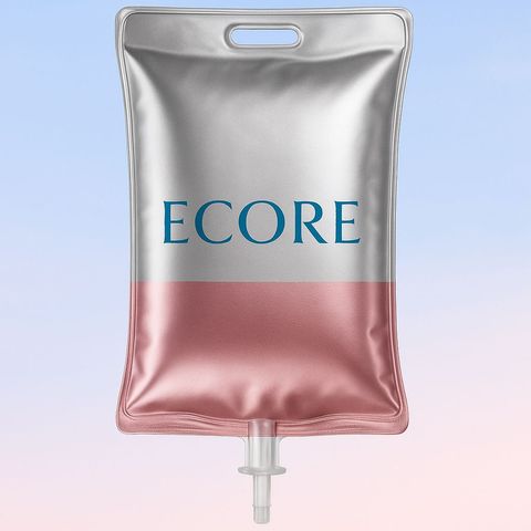 Clear IV drip bag hanging with tubing and droplets in a clinical setting