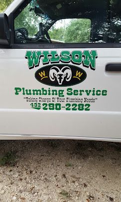 A white service truck door featuring a green