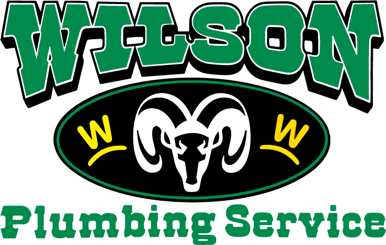 Logo for Wilson Plumbing Service, featuring a white ram head on a black oval, flanked by yellow Ws with green text.
