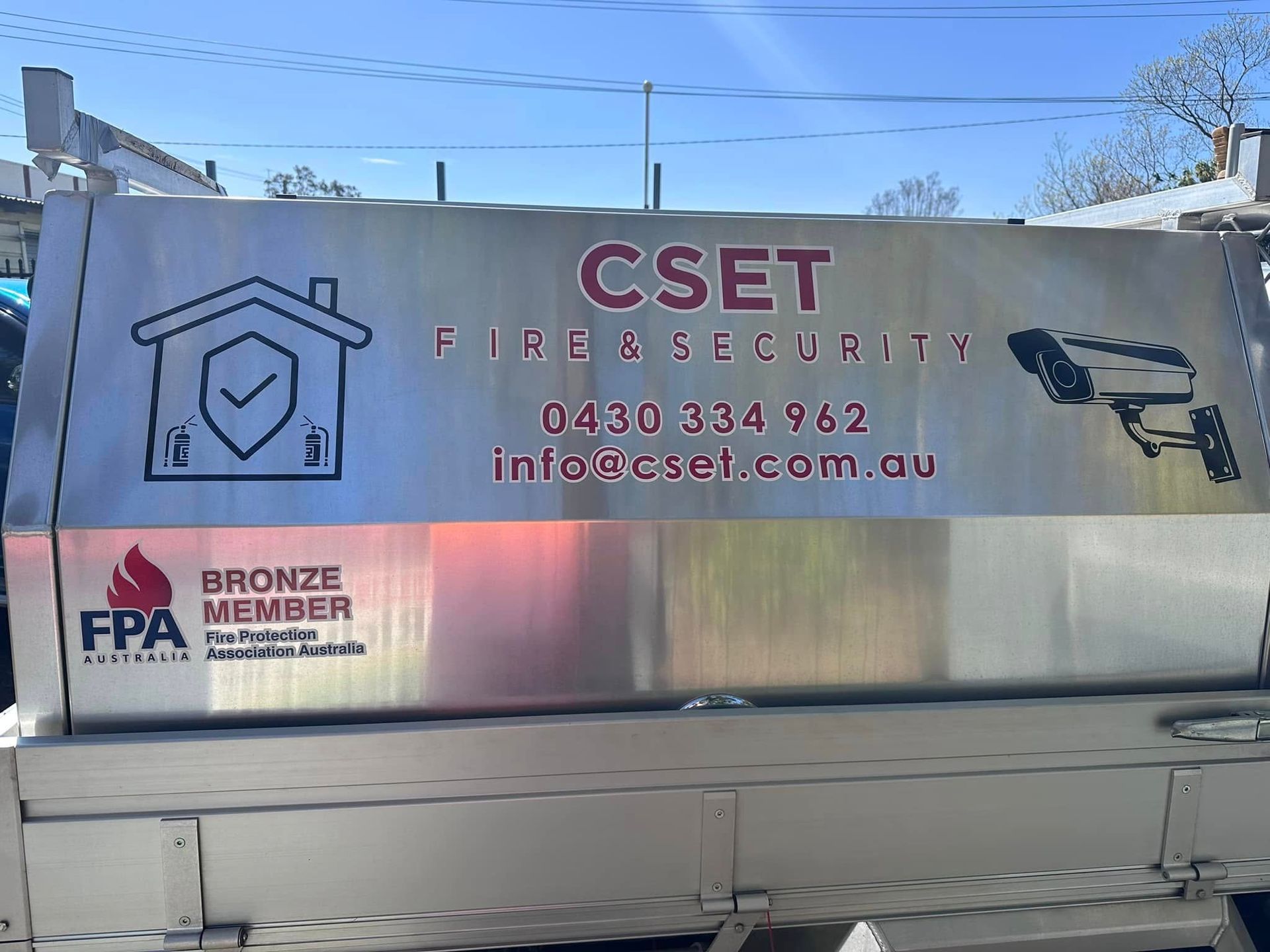CSET Fire Services Sign on a Silver Truck With Blue Sky Overhead — CSET Group Fire & Security in Hunter Valley, NSW