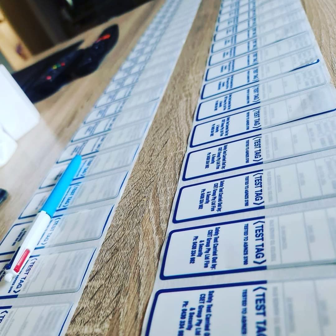 Long Row of Printed Labels on a Tabletop — CSET Group Fire & Security in Hunter Valley, NSW