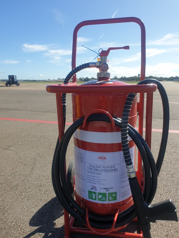 Red Fire Extinguisher With Hose and Handle on a Wheeled Stand — CSET Group Fire & Security in Lake Macquarie, NSW