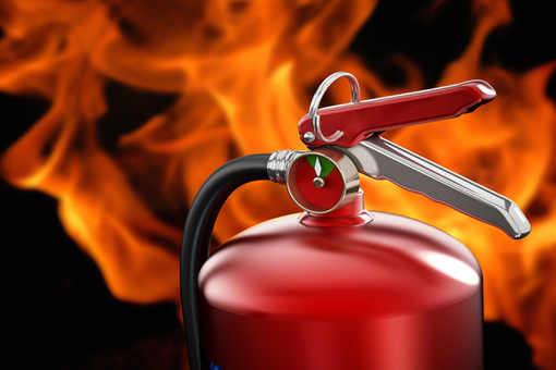 Red Fire Extinguisher With Hose and Handle Against Flames — CSET Group Fire & Security in Lake Macquarie, NSW