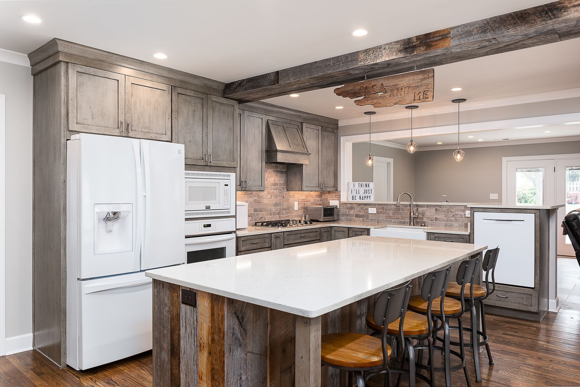There is a large island in the middle of the kitchen.