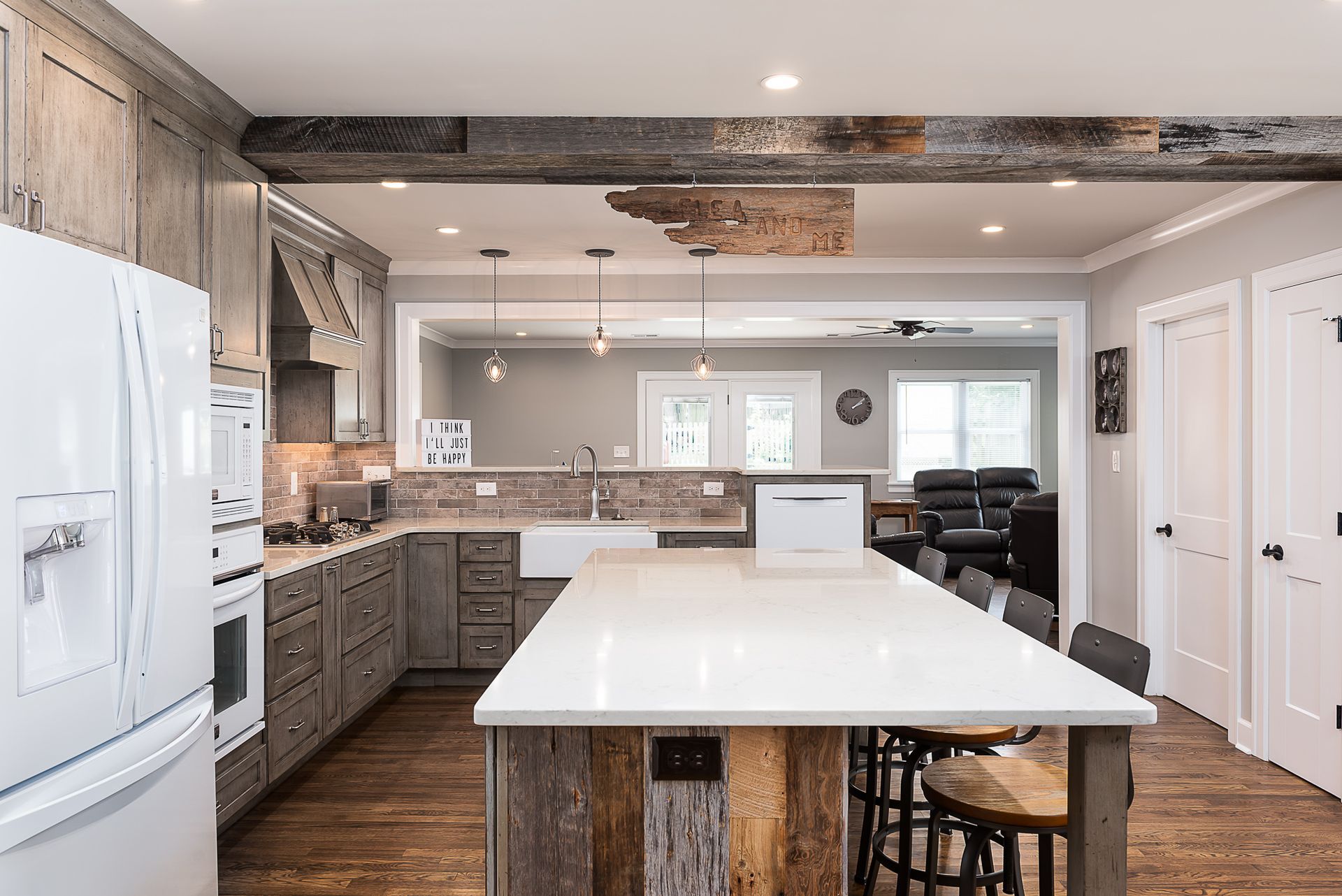 There is a large island in the middle of the kitchen.