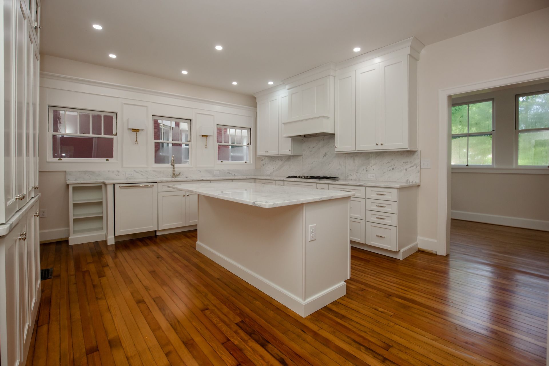 There is a large island in the middle of the kitchen.