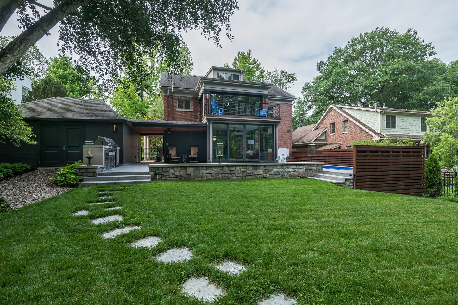 A large house with a large lawn in front of it.