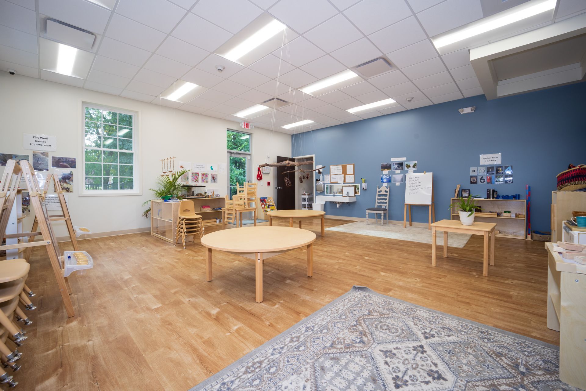 A large room with tables and chairs in it.