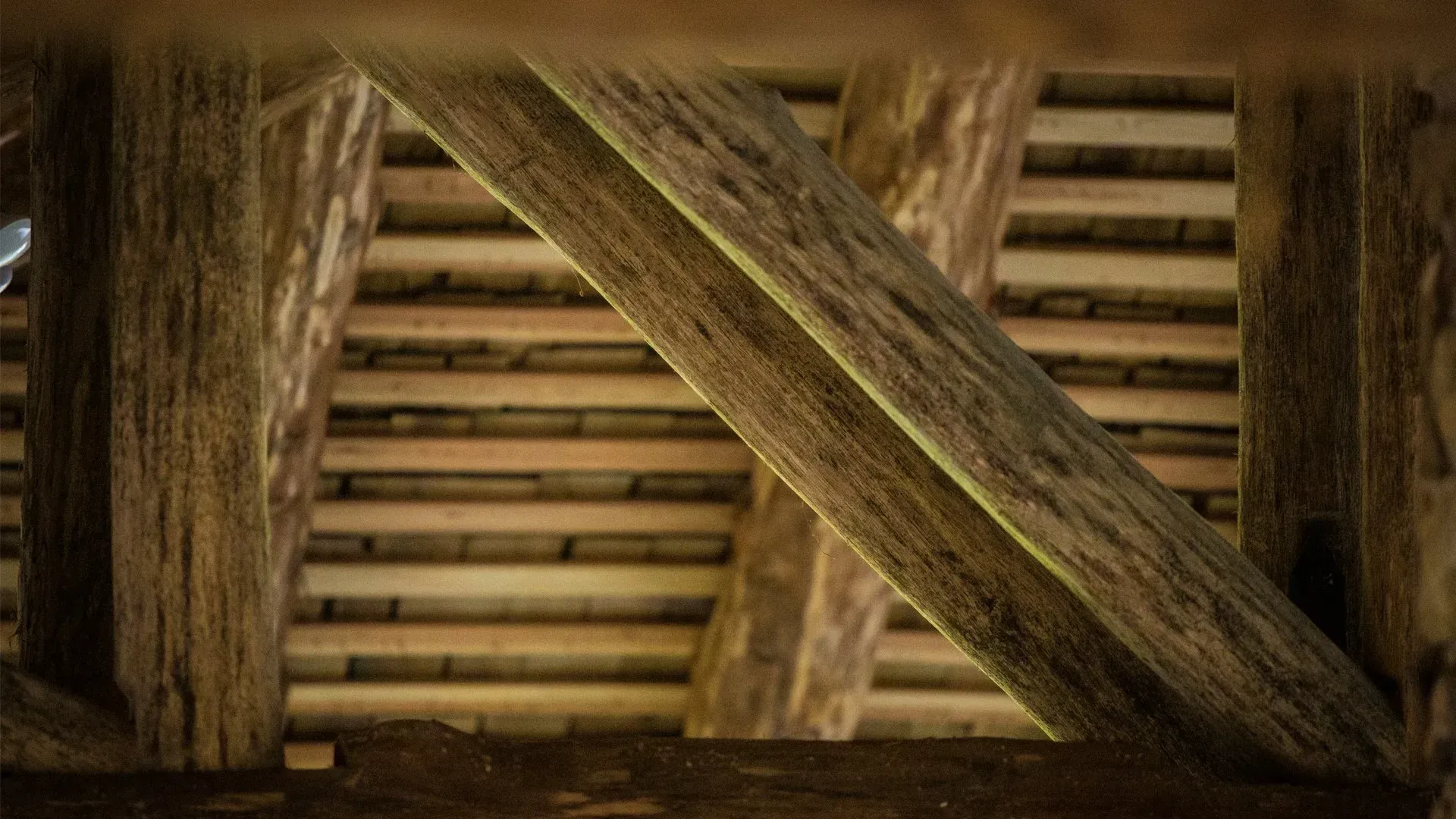 A close up of a wooden beam in a building.
