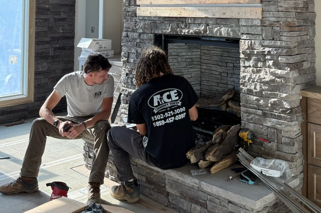 Technicians working on a fireplace