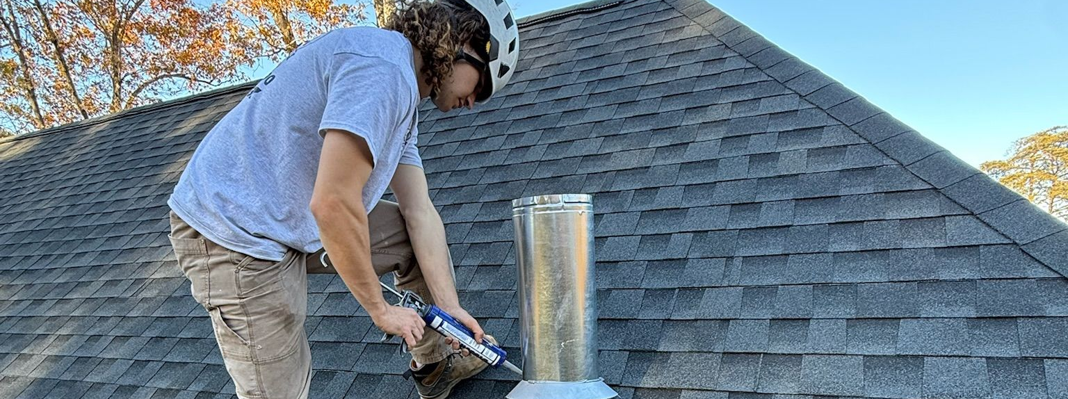 Technician performing a seasonal fireplace and chimney inspection at a Kentucky home