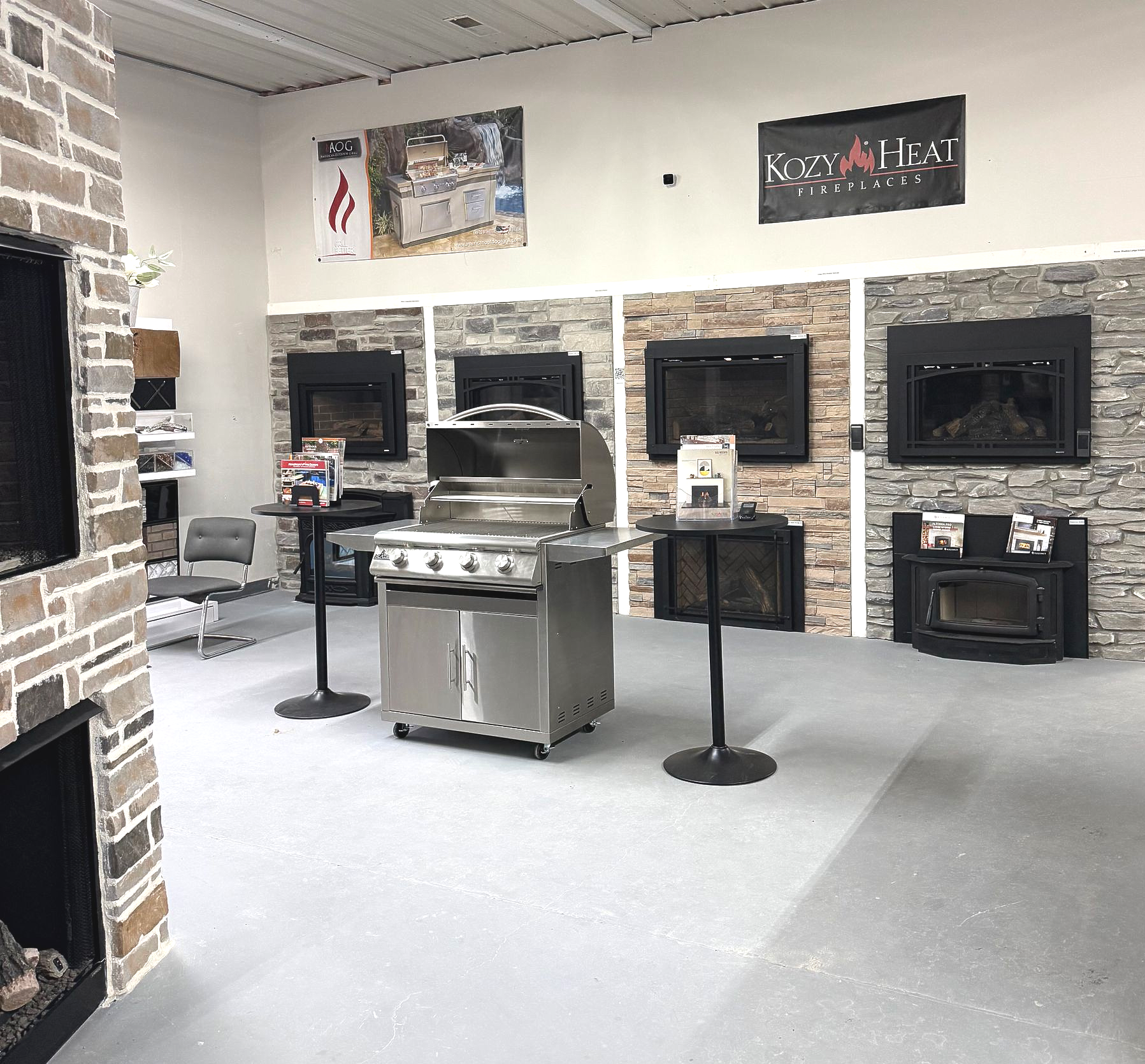 Several built-in fireplaces displayed on stone in the Ace Chimney, Fireplace & Outdoor Living fireplace showcase store