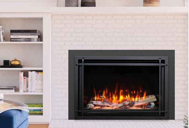 Modern living room with a white brick fireplace and burning fire, framed by built-in shelves.