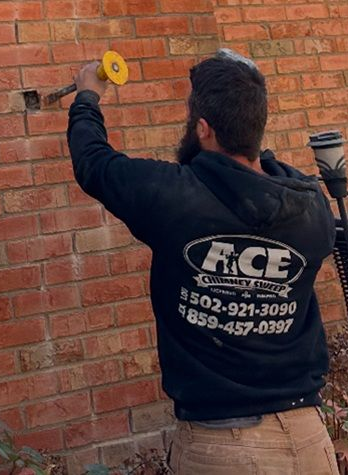 Chimney technician working on masonry repairs