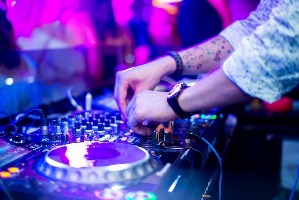 A Dj Is Playing Music On A Mixer At A Party — HYP-E-VENTS In Spence, ACT