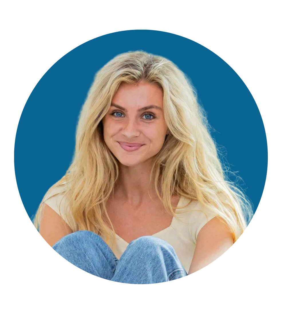Smiling blonde woman with long hair on a blue background, wearing a white top and jeans