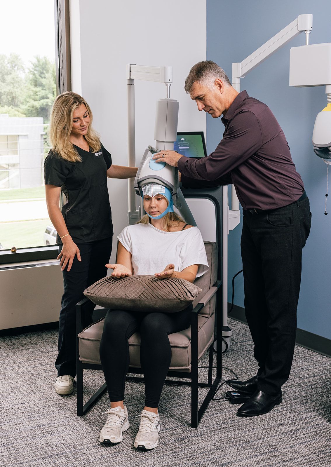 Dr. Roth and TMS technician treating adolescent