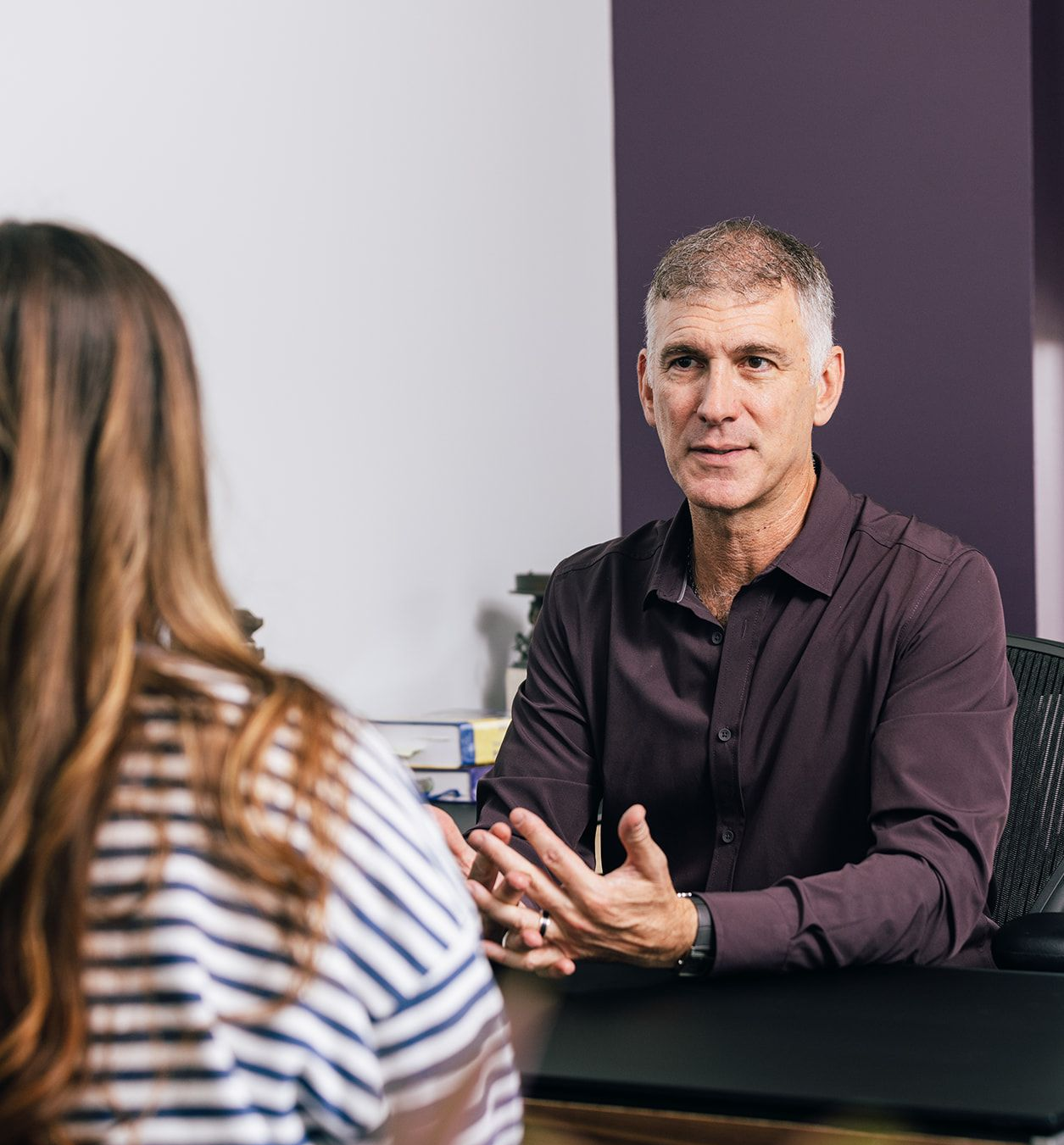 Dr. Roth discussing TMS with young woman for treatment-resistant depression