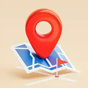Red map pin on a folded blue map, indicating a location.