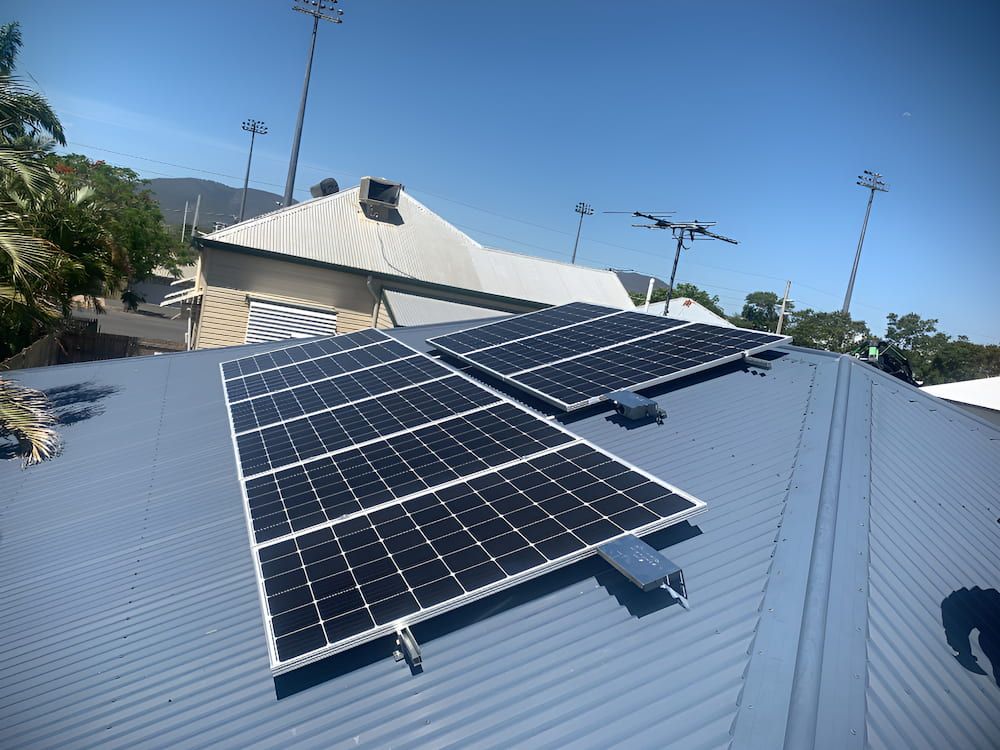 There Are Many Solar Panels On The Roof Of A House — Levi's Electrics in Nerimbera, QLD