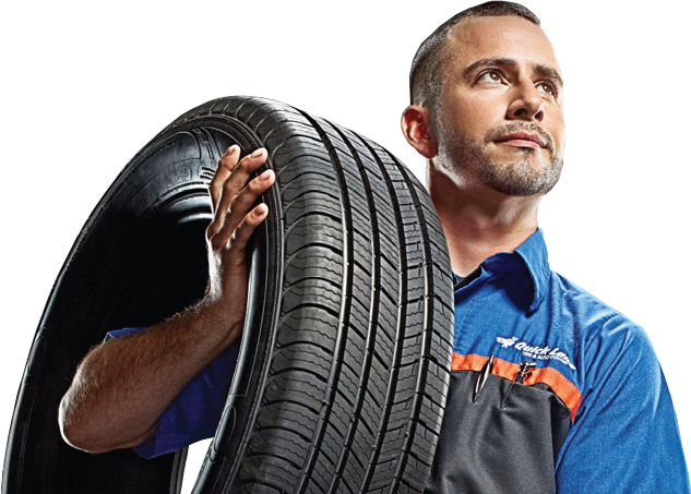 Photo of service advisor holding a new tire