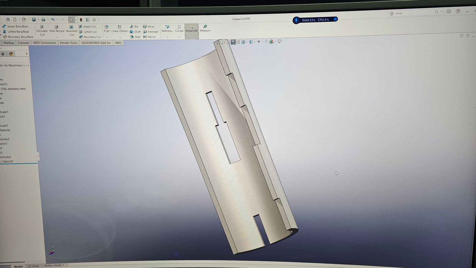 3D CAD model of a tilted cylindrical part on a computer screen, shown in a design program
