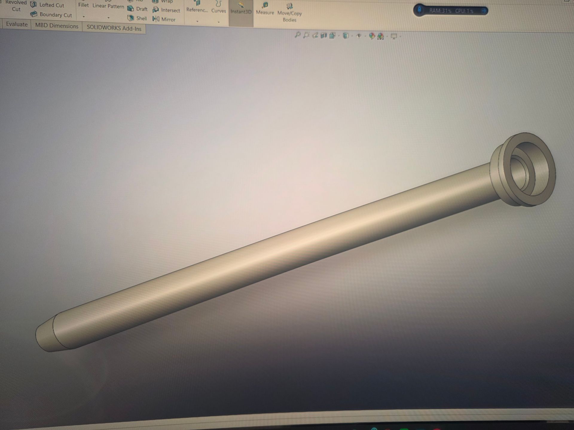 3D CAD rendering of a long cylindrical metal rod with a flanged circular end on a gray background