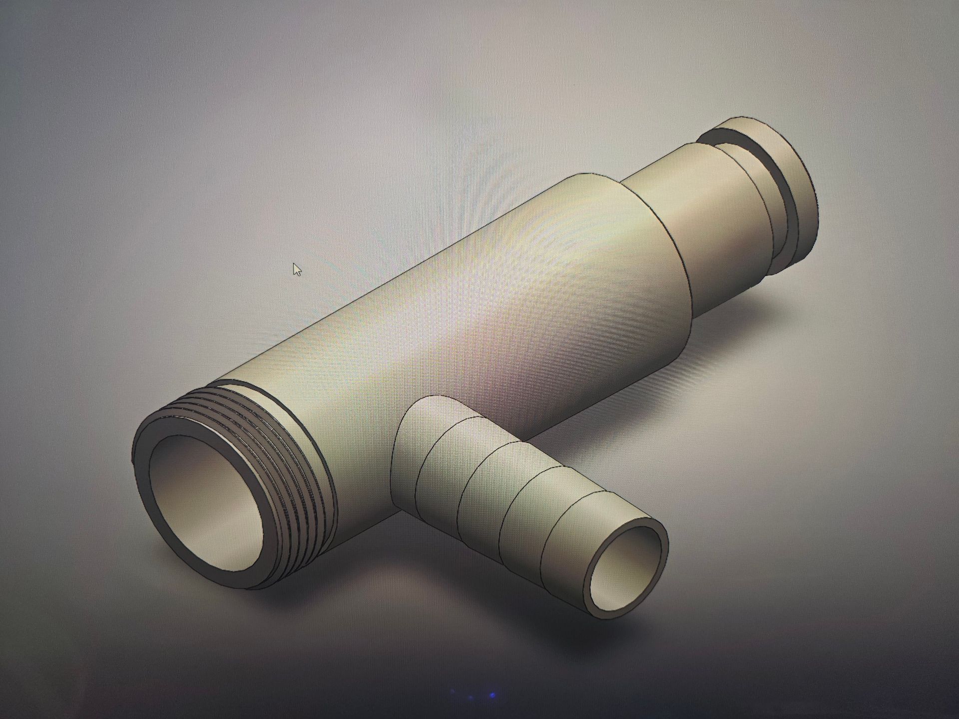 White plastic pipe fitting with a side branch, shown on a gray background