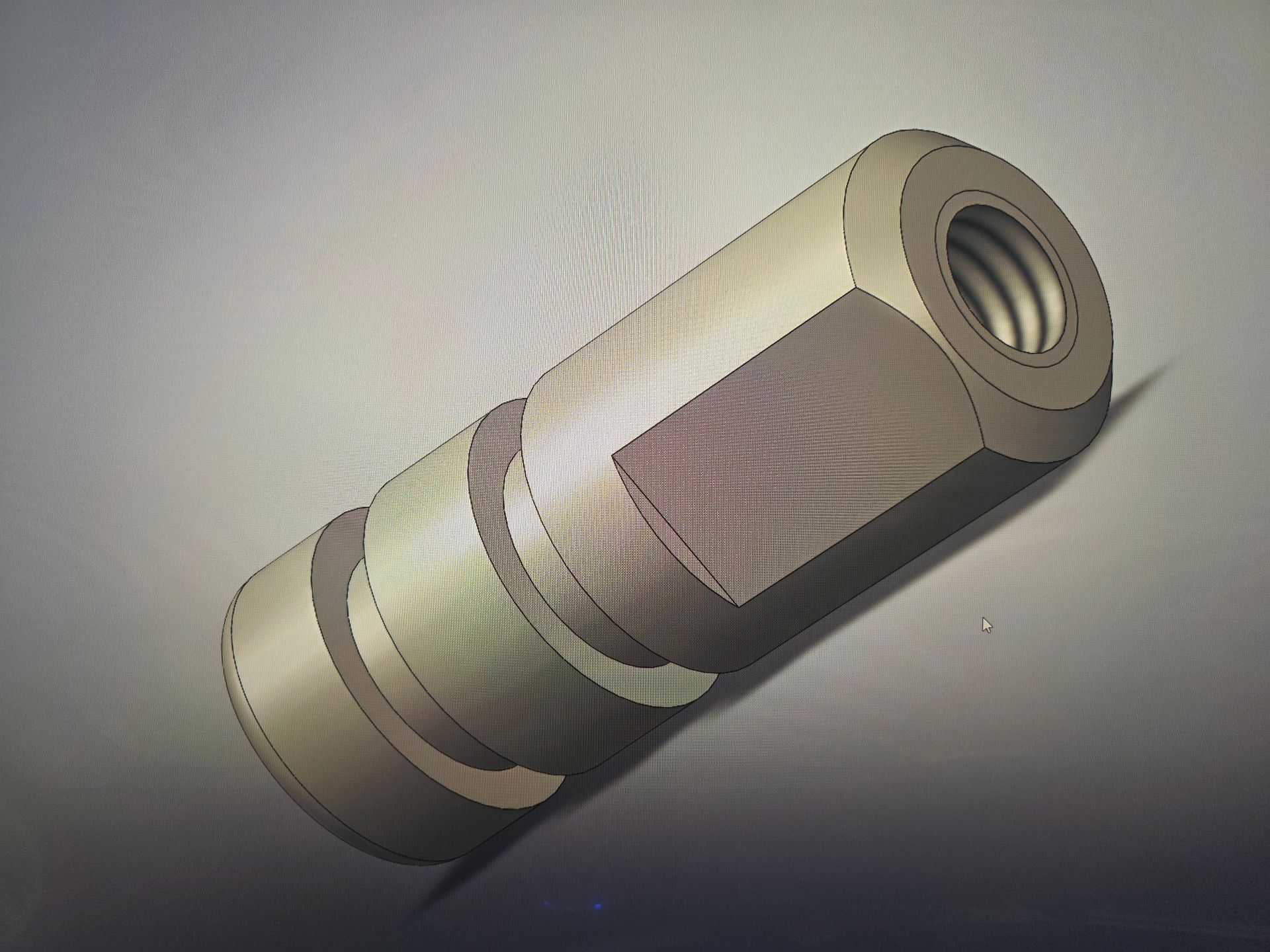 Hexagonal metal fastener with threaded hole, shown on a white background.