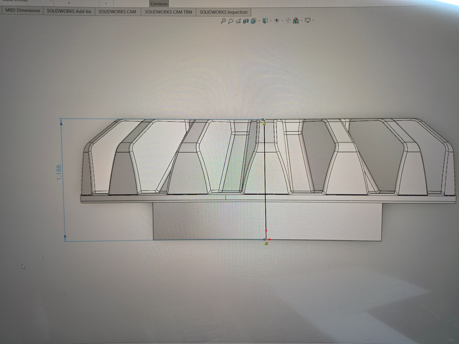 Technical drawing of a long rectangular structure with segmented roof panels and dimension lines.