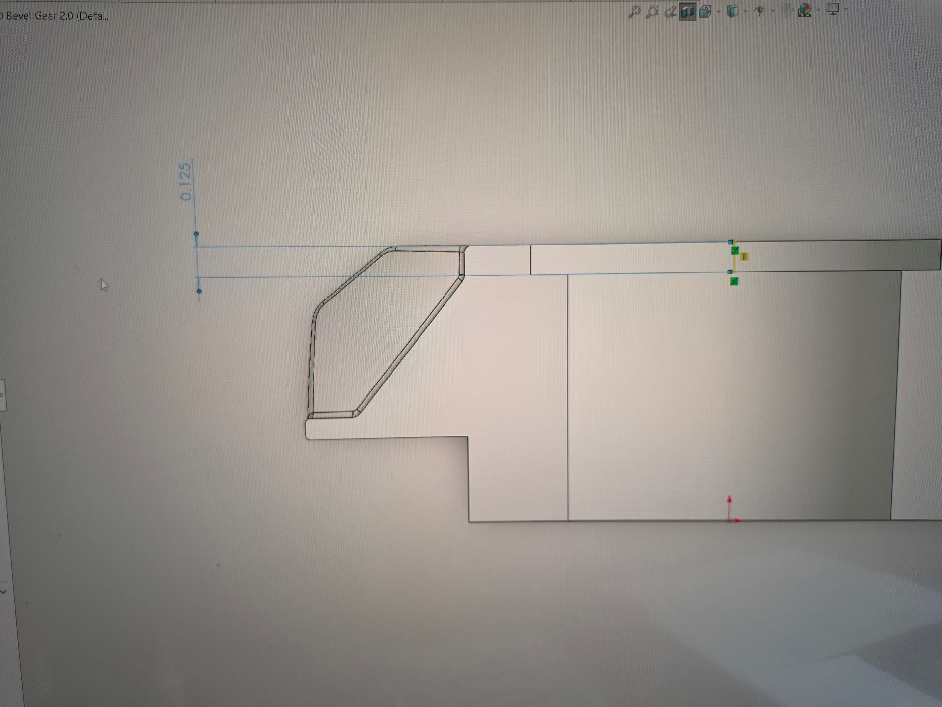 CAD side view of a mechanical part with a slanted left edge and rectangular body, shown on a white workspace