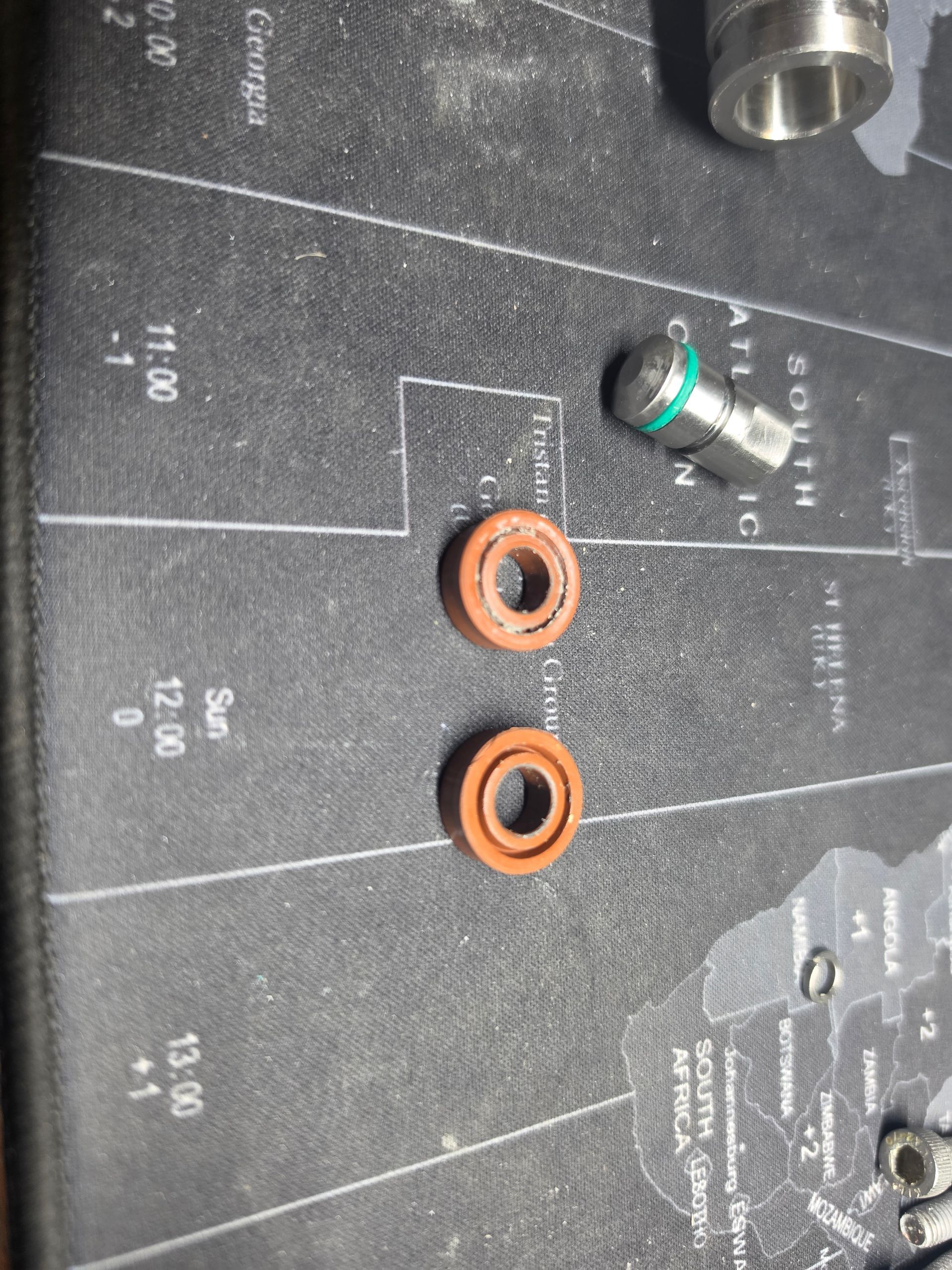 Orange and green audio cables plugged into a black mixer panel with labeled input jacks.