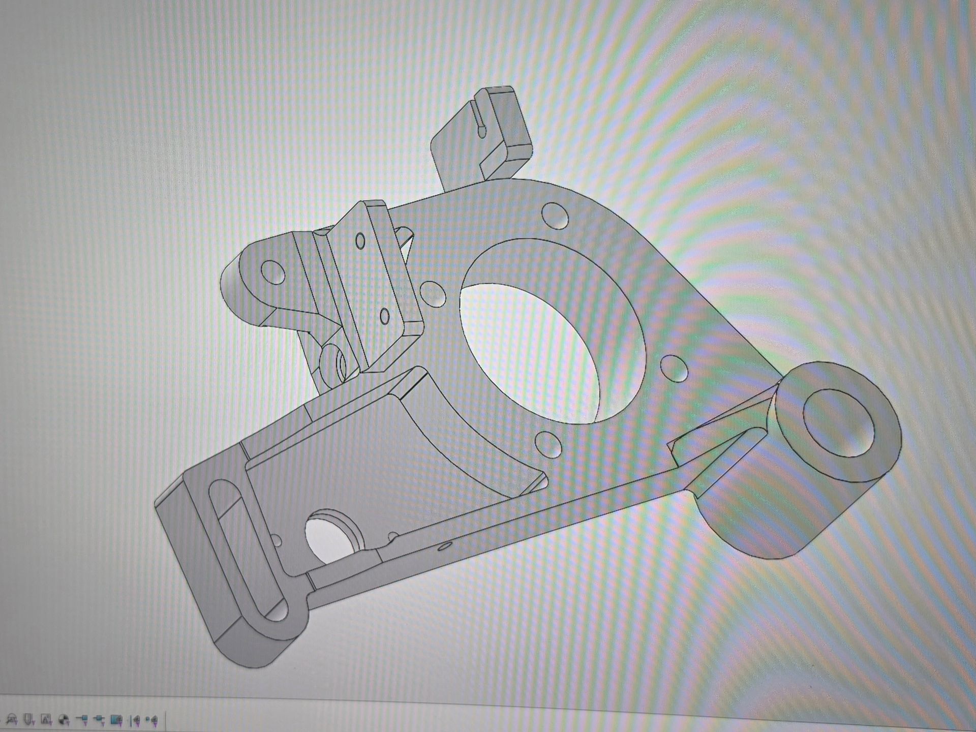 Gray CAD model of a mechanical bracket with multiple holes and mounting arms on a white background