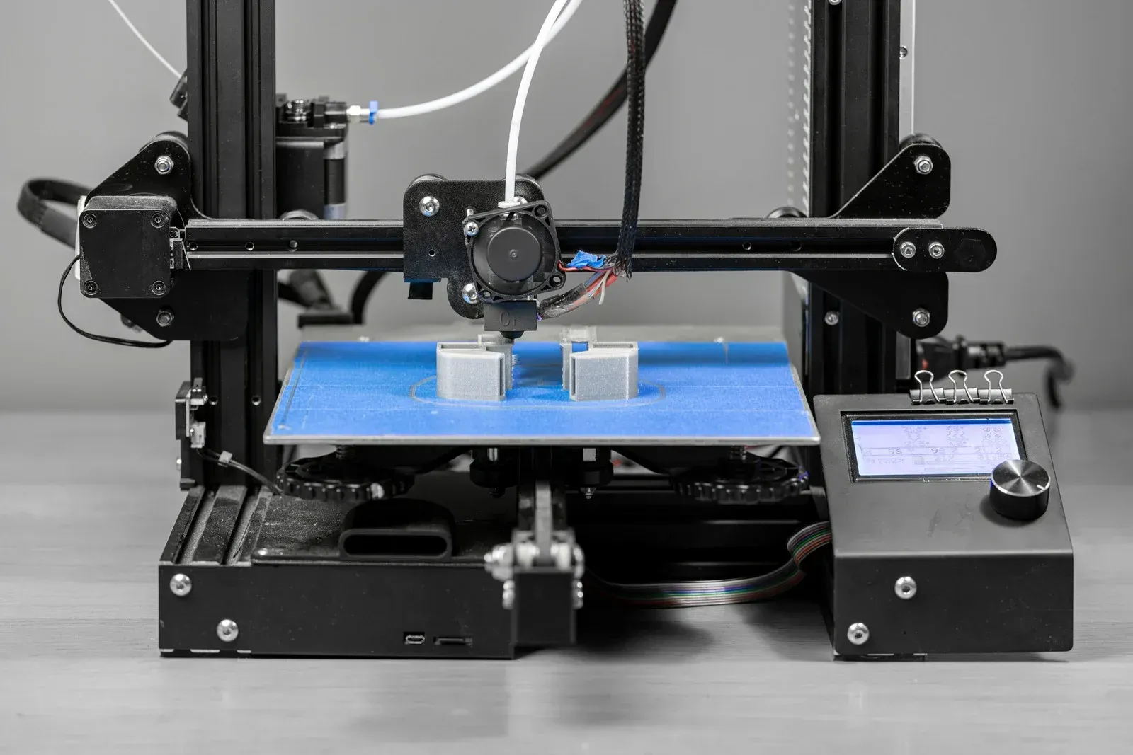 CNC machine milling a metal gear.