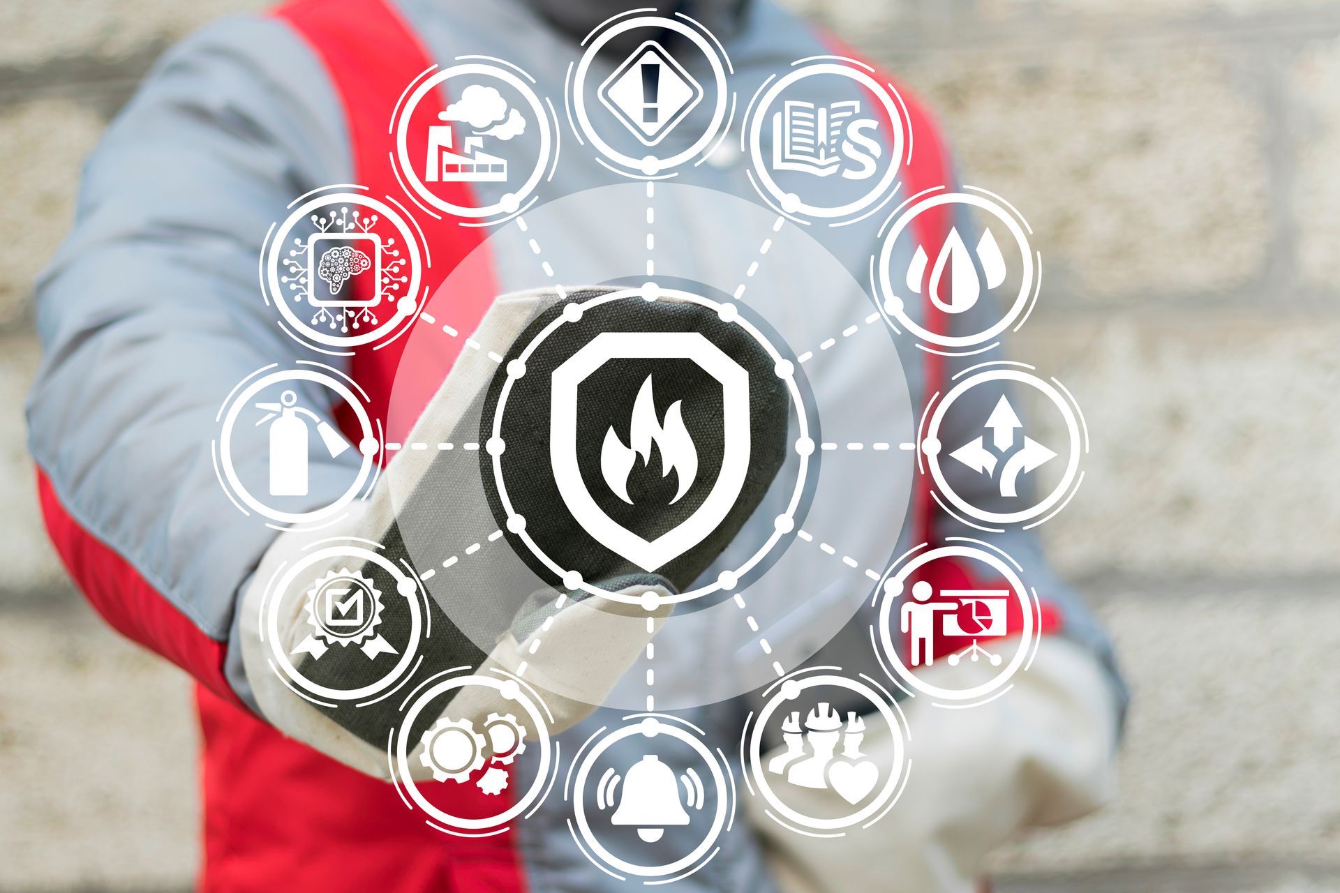 Fire safety icons over a worker in red and gray holding a shield with a flame symbol Fire safety icons over a worker in red and gray holding a shield with a flame symbol