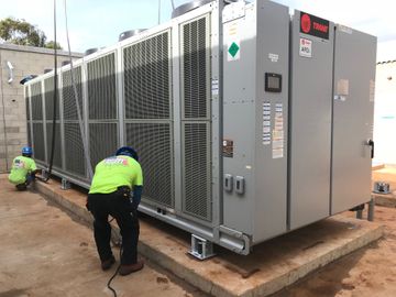 HVAC unit on a rooftop with white vents and metal ducting HVAC unit on a rooftop with white vents and metal ducting